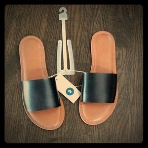 Black Slides, run small.